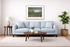 Ibis Walking in the Grass printed on fine art paper, framed on a oak frame and matted. Hung on a living room wall.