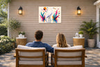 White Egret - Geometric Painting printed on water resistant canvas and mounted on a waterproof frame. Hung on a patio wall with couple.