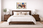Geometric Abstract Painting printed on canvas wall art displayed on a wall above a bed.