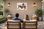 Geometric Abstract Painting printed on water resistant canvas and mounted on a waterproof frame. Hung on a patio wall with couple.