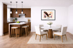 Geometric Painting of an Eagle Catching a Fish printed on fine art paper, framed on a black frame and matted and hung on a wall on a dinette wall.