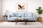 Geometric Painting of an Eagle Catching a Fish printed on fine art paper, framed on a oak frame and matted. Hung on a living room wall.