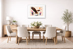 Geometric Painting of an Eagle Catching a Fish printed on fine art paper, framed on a white frame and matted. Hung on a dining room wall.