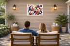 Geometric Fox Painting printed on water resistant canvas and mounted on a waterproof frame. Hung on a patio wall with couple.