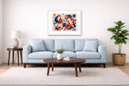 Geometric Fox Painting printed on fine art paper, framed on a white frame and matted. Hung on a living room wall.