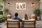 Squirrels at Play - Geometric Painting printed on water resistant canvas and mounted on a waterproof frame. Hung on a patio wall with couple.