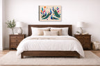 Elegant Peacocks - Geometric Painting printed on canvas wall art displayed on a wall above a bed.