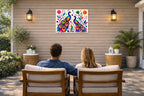 Peacock Pair - Geometric Painting printed on water resistant canvas and mounted on a waterproof frame. Hung on a patio wall with couple.