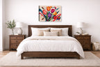 Colorful Tulips - Geometric Painting printed on canvas wall art displayed on a wall above a bed.