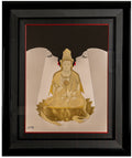 Framed artwork of a gold-colored seated figure on a black background