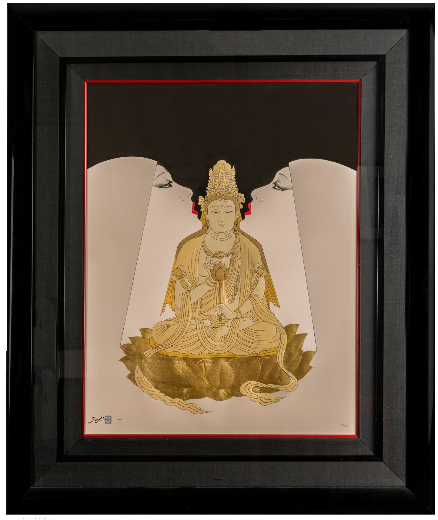 Framed artwork of a gold-colored seated figure on a black background