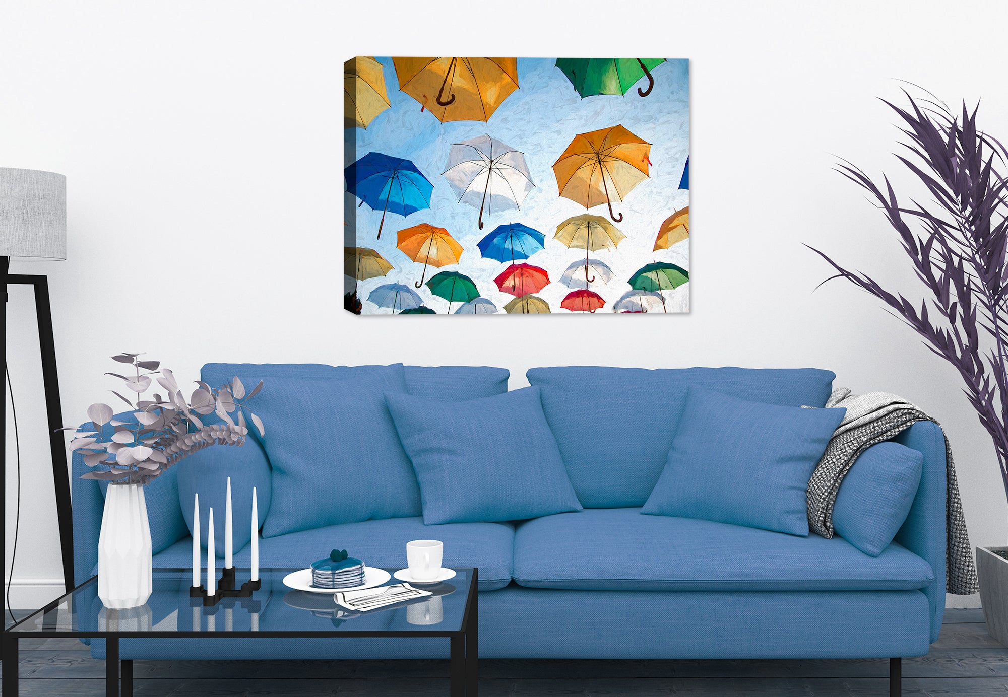 Painting of Multi Colored Umbrellas Floating in the blue Sky - Printed on Canvas - Hanging on a Living Room Wall.