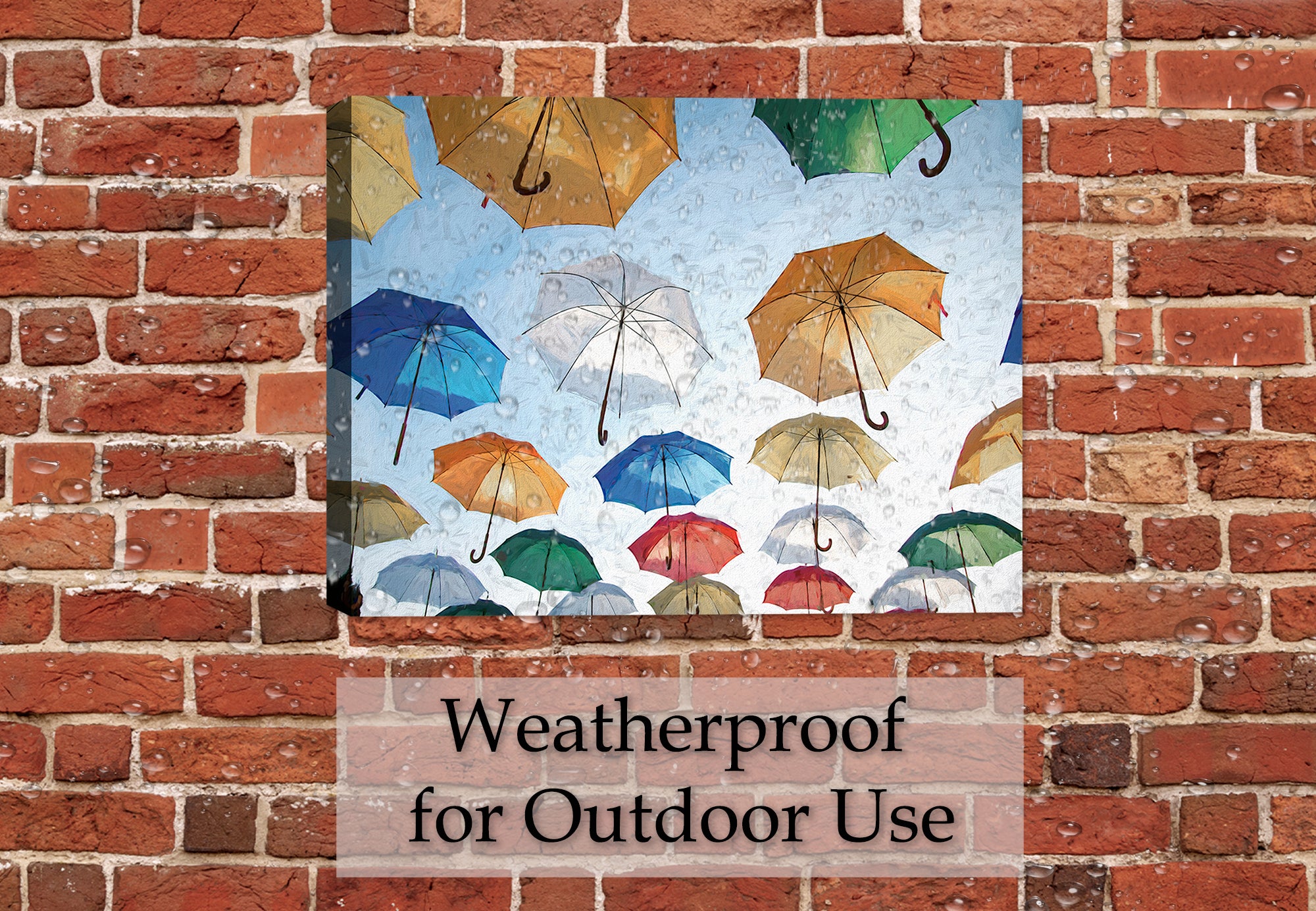 Painting of Multi Colored Umbrellas Floating in the blue Sky - Printed on Canvas - Hanging on a brick patio wall in the rain.