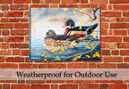 Wood Duck and Bobber by Carol Decker - Printed on Waterproof Canvas - Hanging on Brick Patio Wall in the Rain