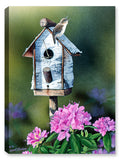 Painting of a Wren sitting on a birch bird house with colorful flowers in the foreground. Printed on Waterproof Canvas for Indoor our Outdoor Use